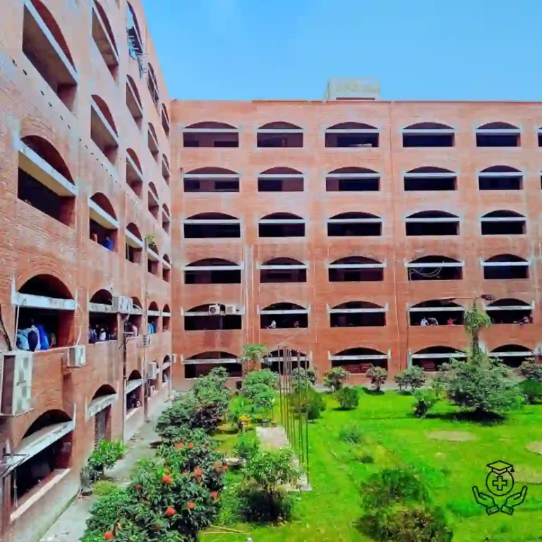 Red brick building with multiple arches and central courtyard garden.