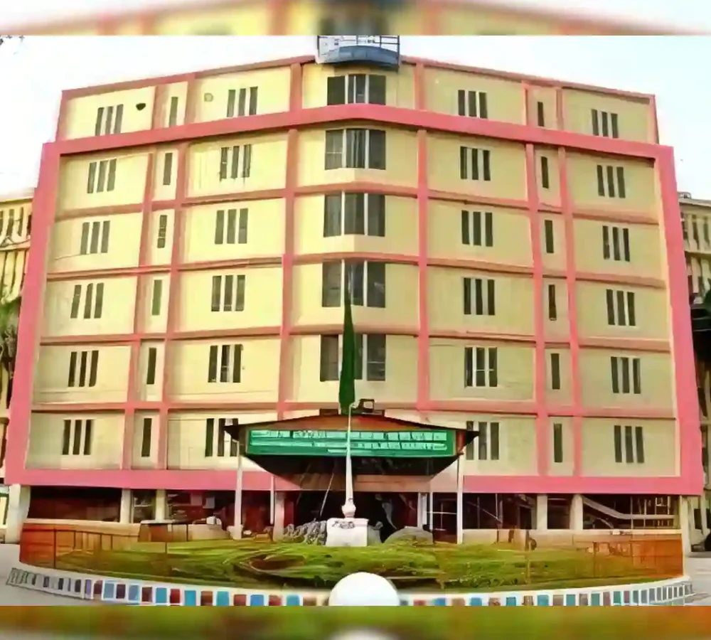 Chittagong Medical College A beige multi-story building with a pink trim and an entrance canopy.