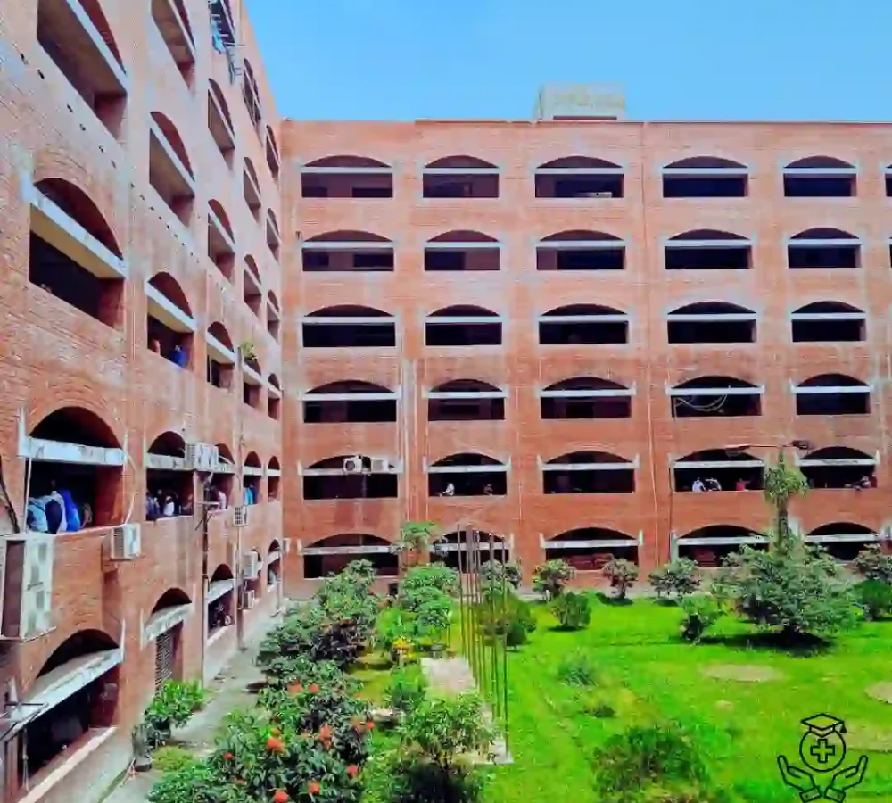 Red brick building with multiple arches and central courtyard garden.